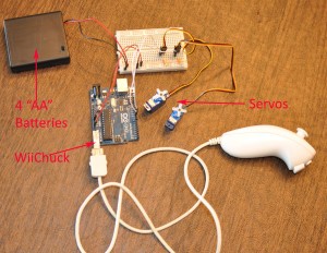 Wii Nunchuck connected to an Arduino Uno controls two servo motors.