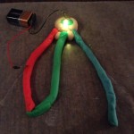 Mixing red and green light to make yellow.