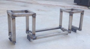 The welded "Halfway" frame with angle brackets bolted on the bottom for mounting the axles.