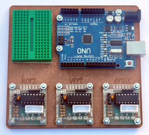 The UNO and the moor drivers screw on, and the small breadboard is attached to the base with adhesive.