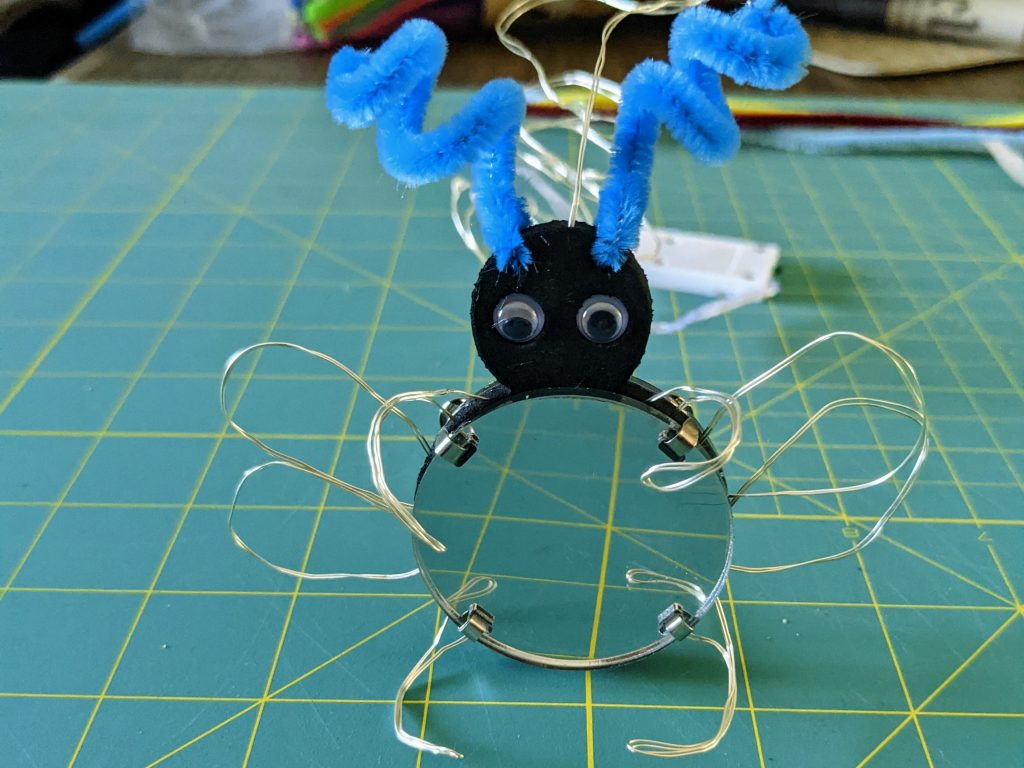 Fairy light creature with pipe cleaner antennae